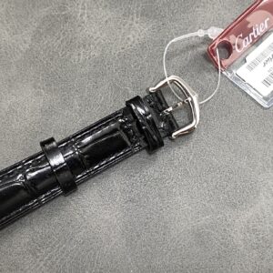 a hand holding a watch